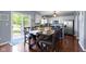 Dining area with white cabinets, stainless appliances, and a sliding glass door at 5593 Ralfe Rd, Indianapolis, IN 46234