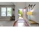 Welcoming foyer with hardwood floors, a view of the front yard, and stylish decor accents at 5593 Ralfe Rd, Indianapolis, IN 46234