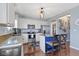 Bright kitchen features white cabinets, an island, and stainless steel appliances at 5593 Ralfe Rd, Indianapolis, IN 46234