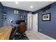Comfortable office space with blue walls, built-in desk, and carpeted floor at 5593 Ralfe Rd, Indianapolis, IN 46234