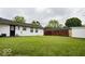 Large grassy backyard with a spacious area for outdoor activities and potential for landscaping at 5605 Glencoe St, Indianapolis, IN 46226