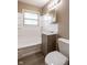 Bathroom featuring a modern vanity, mirror, and fixtures, creating a functional and stylish space at 5605 Glencoe St, Indianapolis, IN 46226