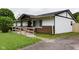 Charming home with a welcoming ramp, perfect for accessibility and easy entry at 5605 Glencoe St, Indianapolis, IN 46226