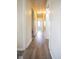 Long hallway with new floors leading to various rooms, filled with natural light at 5605 Glencoe St, Indianapolis, IN 46226