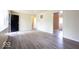 Open living room with light-colored walls and modern flooring, bathed in natural light at 5605 Glencoe St, Indianapolis, IN 46226