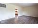 Cozy living room with a glimpse into the adjacent kitchen, showcasing the open floor plan at 5605 Glencoe St, Indianapolis, IN 46226