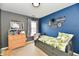Stylish ' bedroom featuring a gray and blue color scheme, decor, and a window at 5611 Burning Tree Ct, Indianapolis, IN 46239
