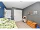 Well organized ' bedroom showcasing a play kitchen, and a closet with sliding doors at 5611 Burning Tree Ct, Indianapolis, IN 46239