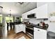 Stylish kitchen featuring white cabinetry, granite countertops, and stainless steel appliances at 5611 Burning Tree Ct, Indianapolis, IN 46239