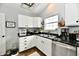 Bright kitchen with white cabinets, granite countertops, stainless appliances, and ample counter space at 5611 Burning Tree Ct, Indianapolis, IN 46239