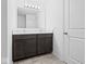 Bathroom featuring double vanity with modern fixtures and a large mirror at 564 Plowman Dr, Shelbyville, IN 46176