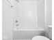 Bright white bathroom features a modern shower-tub combo with sleek fixtures at 564 Plowman Dr, Shelbyville, IN 46176