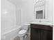 Bathroom features a marble countertop vanity and shower-tub combo at 564 Plowman Dr, Shelbyville, IN 46176
