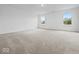 Expansive bedroom with neutral carpet and two windows providing natural light at 564 Plowman Dr, Shelbyville, IN 46176