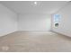 Spacious bedroom with neutral carpet and ample natural light from the window at 564 Plowman Dr, Shelbyville, IN 46176