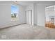 Bright bedroom featuring soft carpeting, natural light, and a view to the outside at 564 Plowman Dr, Shelbyville, IN 46176