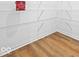 Walk-in pantry featuring white shelving and light wood flooring for convenient storage at 564 Plowman Dr, Shelbyville, IN 46176