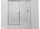 A walk-in shower with sliding glass doors and bright lighting at 564 Plowman Dr, Shelbyville, IN 46176