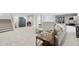 Expansive finished basement includes workout area, sofa, and stairs leading to the main floor at 5667 Skylark Dr, Greenwood, IN 46143