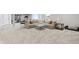 Finished basement with a large sectional sofa, carpeted floor, and ample natural light from the window at 5667 Skylark Dr, Greenwood, IN 46143