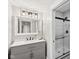 Modern bathroom featuring a sleek vanity with stylish fixtures and a glass-enclosed shower at 5667 Skylark Dr, Greenwood, IN 46143