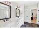 Stylish bathroom with double vanity, framed mirrors, and modern fixtures at 5667 Skylark Dr, Greenwood, IN 46143