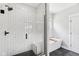 Spa-like bathroom features a walk-in shower with a glass door, a white tiled surround and a free-standing tub at 5667 Skylark Dr, Greenwood, IN 46143