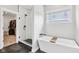 Relaxing bathroom with a free-standing tub, a walk-in shower with glass door and tile surround at 5667 Skylark Dr, Greenwood, IN 46143