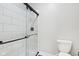 Contemporary bathroom showcasing a glass shower with white subway tile and matte black hardware at 5667 Skylark Dr, Greenwood, IN 46143