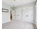 Bedroom featuring neutral carpet, white closet doors, and white trim at 5667 Skylark Dr, Greenwood, IN 46143