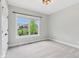 Bedroom featuring a window with neighborhood views, neutral carpet, and white trim at 5667 Skylark Dr, Greenwood, IN 46143