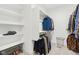 Walk-in closet with ample shelving and hanging space for organized storage at 5667 Skylark Dr, Greenwood, IN 46143