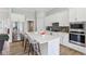 Open concept kitchen featuring a center island with barstool seating and stainless steel appliances at 5667 Skylark Dr, Greenwood, IN 46143