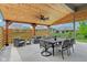 Cozy covered patio includes a dining area and comfortable seating, ideal for outdoor gatherings and relaxation at 5667 Skylark Dr, Greenwood, IN 46143