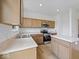 The kitchen offers stainless steel appliances, generous countertops, and center island at 576 Plowman Dr, Shelbyville, IN 46176