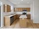 Modern kitchen featuring stainless steel appliances, center island, and ample counter space at 576 Plowman Dr, Shelbyville, IN 46176