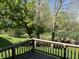 View from the back deck overlooking a grassy yard, mature trees, and creek with the peaceful sound of nature at 636 Mallards Xing # 2-A, Martinsville, IN 46151