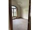Bedroom featuring plush carpet, a light fixture, and natural light from the window at 636 Mallards Xing # 2-A, Martinsville, IN 46151