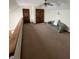Cozy loft area with carpet flooring, a couch, and natural lighting at 636 Mallards Xing # 2-A, Martinsville, IN 46151