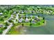 Discover a lakeside community with lush greenery and well-maintained homes in this aerial shot at 6624 Lakestone Ct, Indianapolis, IN 46237