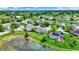 Beautiful homes in the area near a lake are showcased in this aerial view of the neighborhood at 6624 Lakestone Ct, Indianapolis, IN 46237