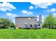 Spacious backyard with a well-maintained lawn, deck, and slide, perfect for outdoor activities at 6624 Lakestone Ct, Indianapolis, IN 46237