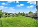 Lush backyard with green grass, a pond view, and beautiful landscaping, ideal for outdoor enjoyment at 6624 Lakestone Ct, Indianapolis, IN 46237