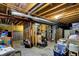 Unfinished basement with exposed ductwork, utilities, and ample storage space at 6624 Lakestone Ct, Indianapolis, IN 46237