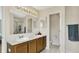 Bright and airy bathroom featuring double sinks, granite countertops, and modern fixtures at 6624 Lakestone Ct, Indianapolis, IN 46237