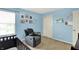 A bright Bedroom featuring a gray recliner and light blue walls at 6624 Lakestone Ct, Indianapolis, IN 46237
