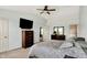 Bright primary bedroom featuring a ceiling fan, and soft carpeting at 6624 Lakestone Ct, Indianapolis, IN 46237