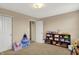 A bedroom features a closet, play vanity and is perfect as a play area at 6624 Lakestone Ct, Indianapolis, IN 46237
