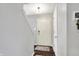 Inviting entryway with hardwood floors, a coat closet, and stairs leading to the upper level at 6624 Lakestone Ct, Indianapolis, IN 46237