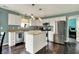 Modern kitchen with stainless steel appliances, an island, and ample counter space at 6624 Lakestone Ct, Indianapolis, IN 46237
